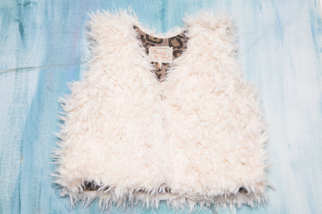 Baby and Toddler Girls White Faux Fur Vest with Animal Print Lining | Born By The Shore